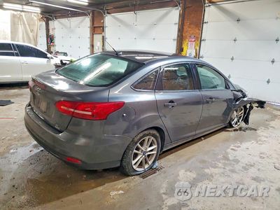 Trzecie zdjęcie samochodu z tyłu: 2018 FORD FOCUS SE VIN:1FADP3FE1JL301223 - miniatura