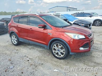 Czwarte zdjęcie samochodu z boku: 2016 FORD ESCAPE TITANIUM VIN:1FMCU9J98GUC23131 - miniatura