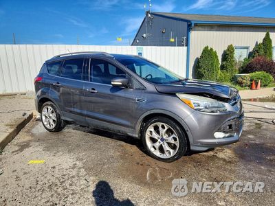 Czwarte zdjęcie samochodu z boku: 2014 FORD ESCAPE TITANIUM VIN:1FMCU0J9XEUB56041 - miniatura