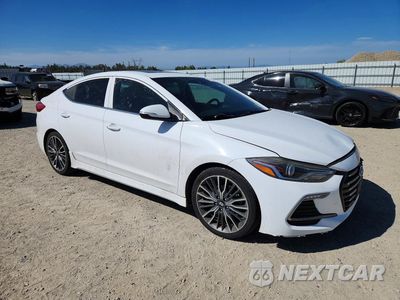 Czwarte zdjęcie samochodu z boku: 2018 HYUNDAI ELANTRA SPORT VIN:KMHD04LBXJU456860 - miniatura