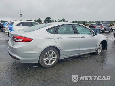 Trzecie zdjęcie samochodu z tyłu: 2018 FORD FUSION SE HYBRID VIN:3FA6P0LU8JR170196 - miniatura
