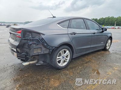 Trzecie zdjęcie samochodu z tyłu: 2018 FORD FUSION SE HYBRID VIN:3FA6P0LU7JR210381 - miniatura