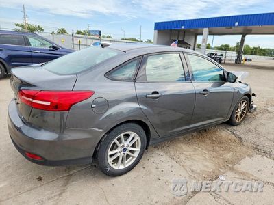 Trzecie zdjęcie samochodu z tyłu: 2017 FORD FOCUS SE VIN:1FADP3F21HL229388 - miniatura