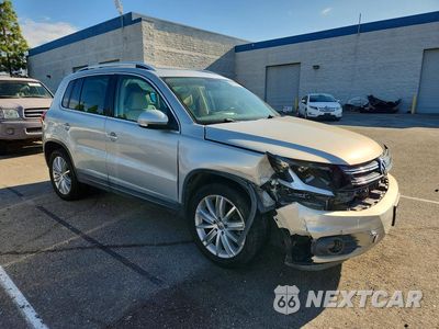 Czwarte zdjęcie samochodu z boku: 2013 VOLKSWAGEN TIGUAN S VIN:WVGAV3AX0DW585129 - miniatura