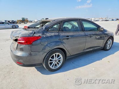 Trzecie zdjęcie samochodu z tyłu: 2017 FORD FOCUS SE VIN:1FADP3F2XHL320059 - miniatura