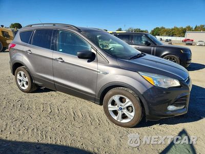 Czwarte zdjęcie samochodu z boku: 2014 FORD ESCAPE SE VIN:1FMCU0GX0EUB09560 - miniatura