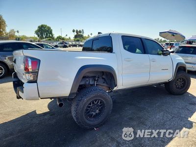 Trzecie zdjęcie samochodu z tyłu: 2022 TOYOTA TACOMA TRD OFF-ROAD VIN:3TMCZ5ANXNM512380 - miniatura
