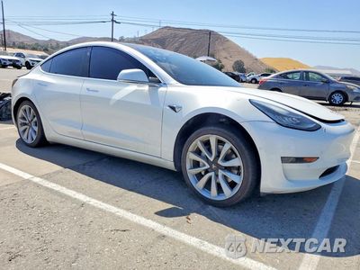 Czwarte zdjęcie samochodu z boku: 2019 TESLA MODEL 3 VIN:5YJ3E1EA5KF476657 - miniatura
