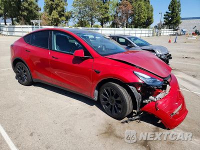 Czwarte zdjęcie samochodu z boku: 2023 TESLA MODEL Y VIN:7SAYGDEE9PA076340 - miniatura