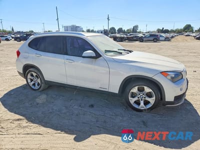 Czwarte zdjęcie samochodu z boku: 2015 BMW X1 SDRIVE28I VIN:WBAVM1C5XFVW57386 - miniatura