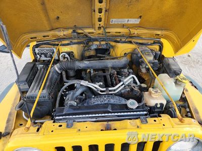 Zdjęcie 12 z 13 samochodu: 2000 JEEP WRANGLER / TJ SPORT VIN:1J4FA49S4YP754518 - miniatura