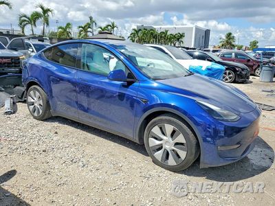 Czwarte zdjęcie samochodu z boku: 2023 TESLA MODEL Y VIN:7SAYGAEE8PF801427 - miniatura