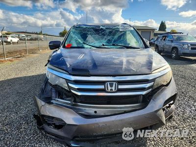 Piąte zdjęcie samochodu w środku: 2017 HONDA PILOT TOURING VIN:5FNYF6H9XHB084820 - miniatura