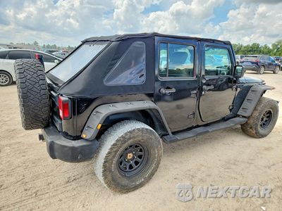 Trzecie zdjęcie samochodu z tyłu: 2010 JEEP WRANGLER UNLIMITED SAHARA VIN:1J4HA5H13AL198349 - miniatura