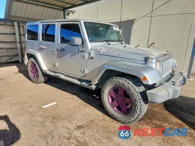 Czwarte zdjęcie samochodu z boku: 2012 JEEP WRANGLER UNLIMITED RUBICON VIN:1C4HJWFG5CL125375 - miniatura