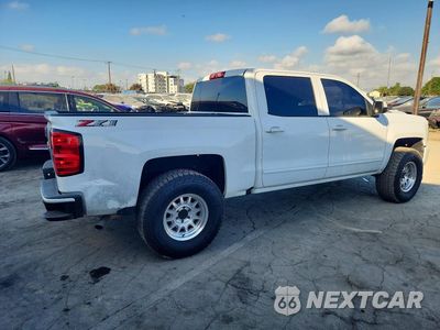 Trzecie zdjęcie samochodu z tyłu: 2018 CHEVROLET SILVERADO K1500 LT VIN:3GCUKREC2JG197866 - miniatura