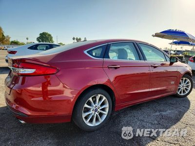 Trzecie zdjęcie samochodu z tyłu: 2017 FORD FUSION SE PHEV VIN:3FA6P0PU1HR106554 - miniatura