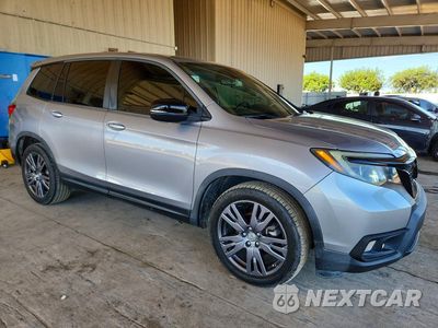 Czwarte zdjęcie samochodu z boku: 2021 HONDA PASSPORT EXL VIN:5FNYF7H58MB010566 - miniatura