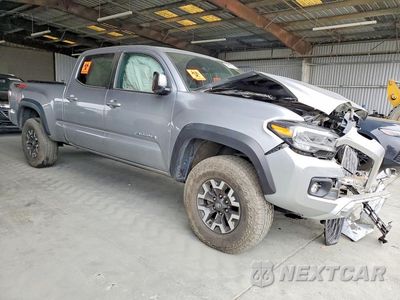 Czwarte zdjęcie samochodu z boku: 2023 TOYOTA TACOMA TRD OFF-ROAD VIN:3TMDZ5BN9PM166358 - miniatura