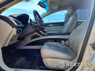 Zdjęcie 7 z 12 samochodu: 2016 LINCOLN MKZ HYBRID VIN:3LN6L2LU2GR628661 - miniatura
