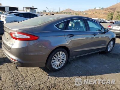 Trzecie zdjęcie samochodu z tyłu: 2014 FORD FUSION SE HYBRID VIN:3FA6P0LU8ER316621 - miniatura