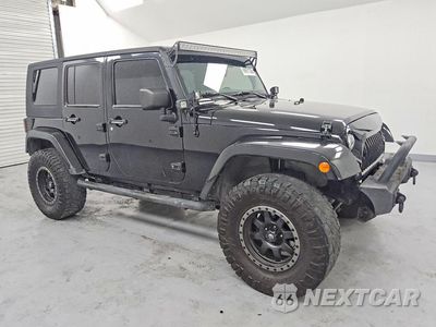 Czwarte zdjęcie samochodu z boku: 2013 JEEP WRANGLER UNLIMITED SPORT VIN:1C4BJWDG8DL649131 - miniatura