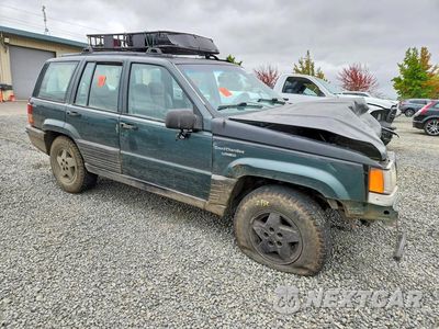 Czwarte zdjęcie samochodu z boku: 1994 JEEP GRAND CHEROKEE LAREDO VIN:1J4GZ58Y8RC270076 - miniatura