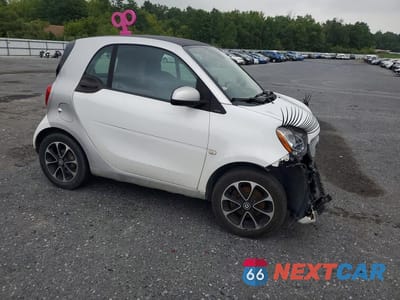 Czwarte zdjęcie samochodu z boku: 2016 SMART FORTWO VIN:WMEFJ5DA8GK051558 - miniatura