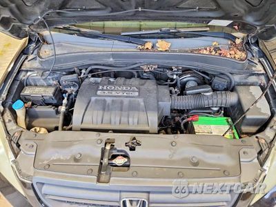 Zdjęcie 12 z 13 samochodu: 2005 HONDA PILOT EXL VIN:5FNYF185X5B052574 - miniatura