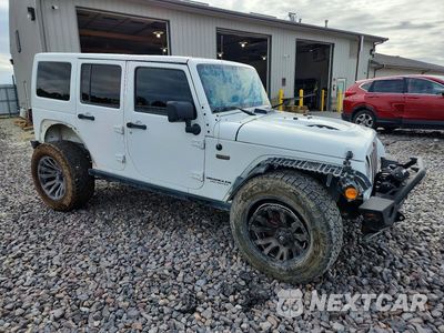 Czwarte zdjęcie samochodu z boku: 2016 JEEP WRANGLER UNLIMITED SAHARA VIN:1C4BJWEG2GL245129 - miniatura