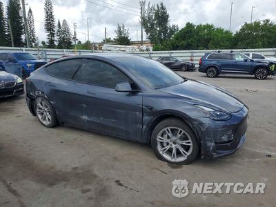 Czwarte zdjęcie samochodu z boku: 2023 TESLA MODEL Y VIN:7SAYGDEEXPA197135 - miniatura