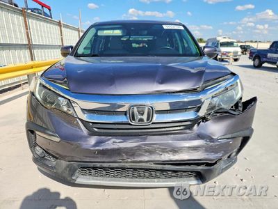 Piąte zdjęcie samochodu w środku: 2020 HONDA PILOT EXL VIN:5FNYF5H59LB026701 - miniatura