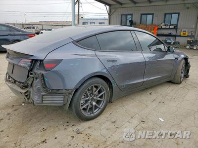 Trzecie zdjęcie samochodu z tyłu: 2023 TESLA MODEL 3 VIN:5YJ3E1EA4PF652511 - miniatura