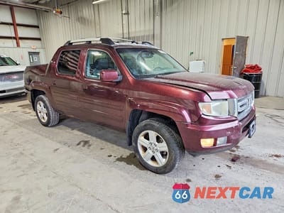 Czwarte zdjęcie samochodu z boku: 2009 HONDA RIDGELINE RTL VIN:2HJYK16519H500565 - miniatura
