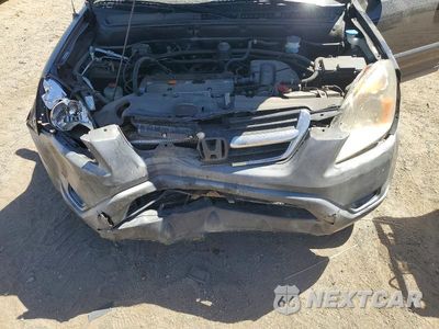 Zdjęcie 11 z 12 samochodu: 2003 HONDA CR-V LX VIN:JHLRD68543C011748 - miniatura