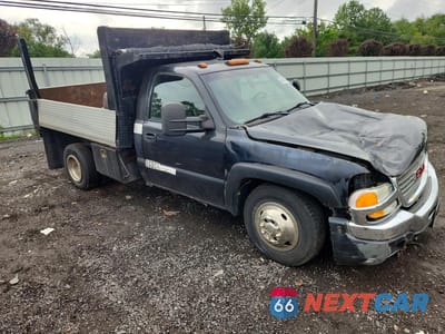 Czwarte zdjęcie samochodu z boku: 2004 GMC SIERRA DUMP TRUCK VIN:1GDJK34UX4E222255 - miniatura