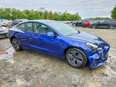 Czwarte zdjęcie samochodu z boku: 2022 TESLA MODEL 3 VIN:5YJ3E1EA8NF370739 - miniatura