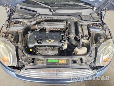 Zdjęcie 11 z 12 samochodu: 2009 MINI COOPER VIN:WMWMR33529TZ18664 - miniatura