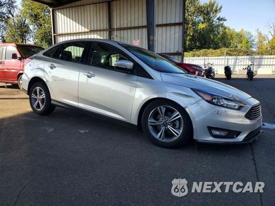 Czwarte zdjęcie samochodu z boku: 2017 FORD FOCUS SE VIN:1FADP3FE3HL292924 - miniatura