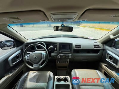Zdjęcie 9 z 10 samochodu: 2006 HONDA RIDGELINE RTL VIN:2HJYK16596H555521 - miniatura