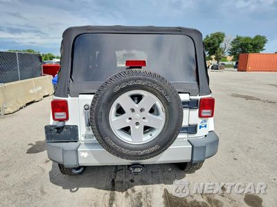 Zdjęcie 6 z 13 samochodu: 2011 JEEP WRANGLER SAHARA VIN:1J4GA5D1XBL572152 - miniatura