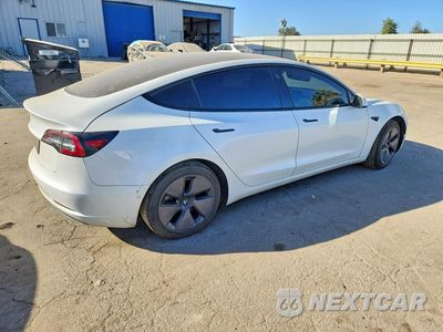 Trzecie zdjęcie samochodu z tyłu: 2021 TESLA MODEL 3 VIN:5YJ3E1EA0MF947732 - miniatura