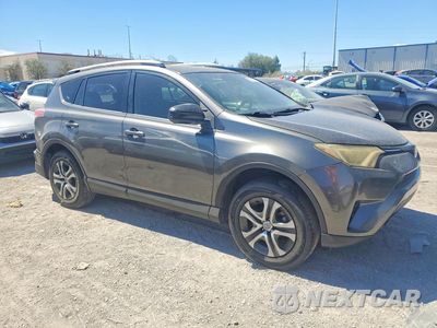 Czwarte zdjęcie samochodu z boku: 2018 TOYOTA RAV4 LE VIN:JTMZFREV7JJ750358 - miniatura