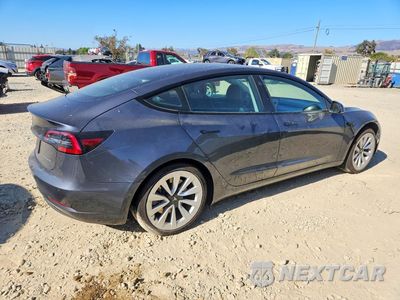 Trzecie zdjęcie samochodu z tyłu: 2022 TESLA MODEL 3 VIN:5YJ3E1EB5NF297953 - miniatura