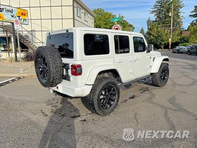 Czwarte zdjęcie samochodu z boku: 2021 JEEP WRANGLER UNLIMITED SAHARA 4XE VIN:1C4JJXP62MW643294 - miniatura
