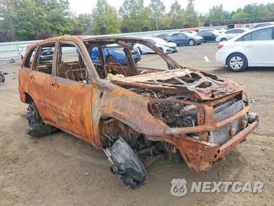 Czwarte zdjęcie samochodu z boku: 2003 TOYOTA RAV4 BASE VIN:JTEHH20V430227615 - miniatura