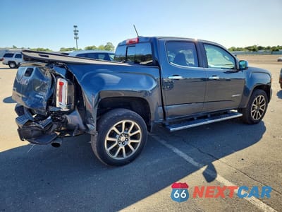 Trzecie zdjęcie samochodu z tyłu: 2018 GMC CANYON DENALI VIN:1GTG6EEN1J1232486 - miniatura