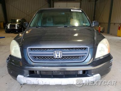 Piąte zdjęcie samochodu w środku: 2004 HONDA PILOT EXL VIN:2HKYF18574H565622 - miniatura