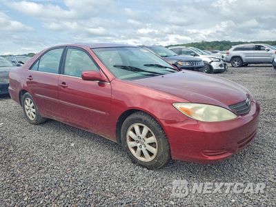 Czwarte zdjęcie samochodu z boku: 2002 TOYOTA CAMRY XLE V6 VIN:4T1BF30K22U004486 - miniatura