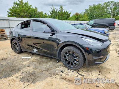 Czwarte zdjęcie samochodu z boku: 2023 TESLA MODEL Y VIN:7SAYGAEEXPF605151 - miniatura